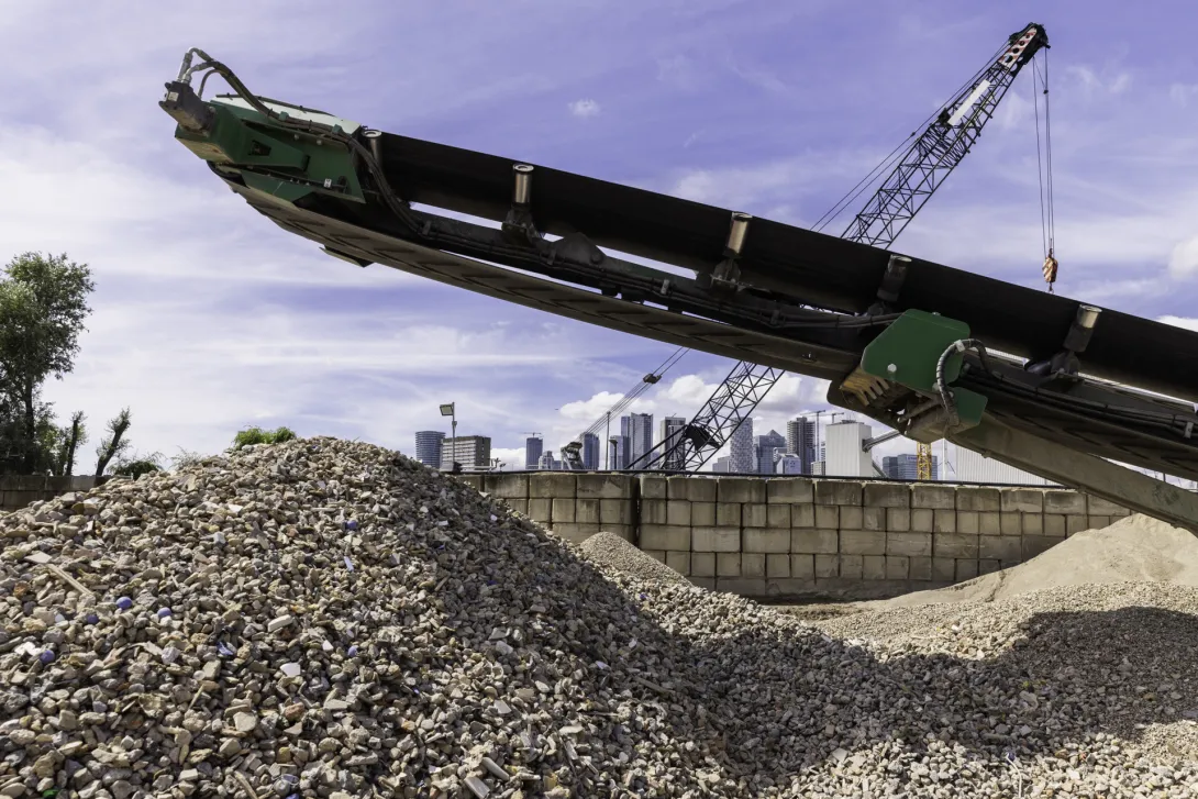 A machine processing construction demolition materials at Sivyer's Mordern Wharf Recycling Hub in London